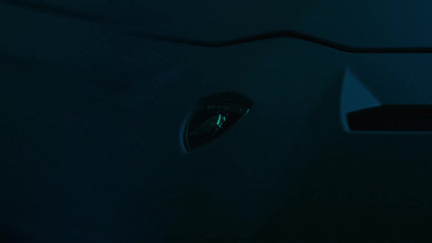 Flashing lights reflect on the car decal
