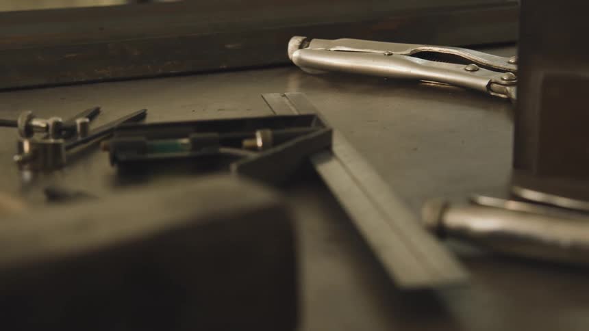 A variety of tools are laid out on a table