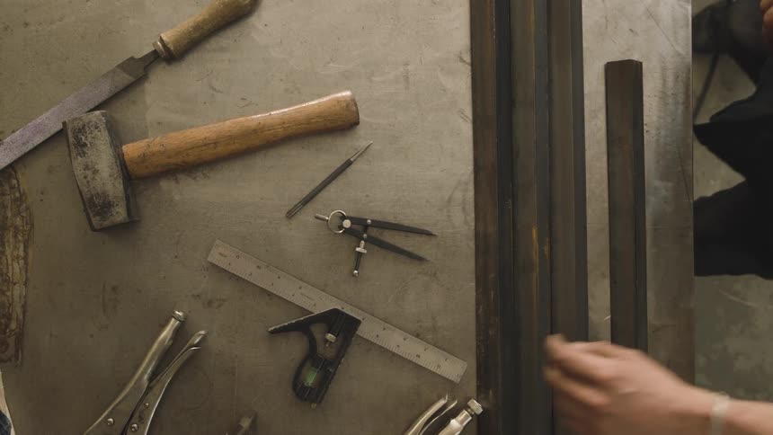A man measure out a piece of material