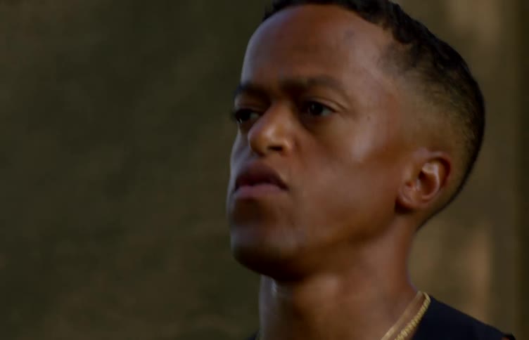 A determined man is captured in a closeup shot while running outdoors for fitness