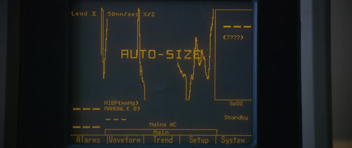 A computer screen with yellow text and graphs