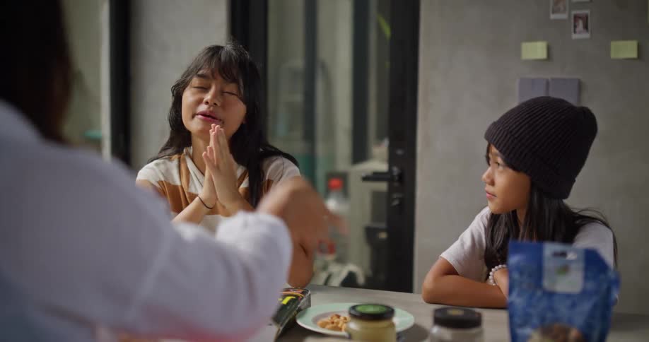 A family talk as the mother serves food