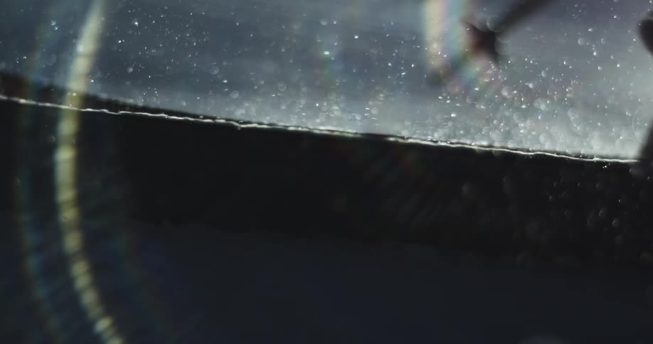 A person skis past on a sunny day
