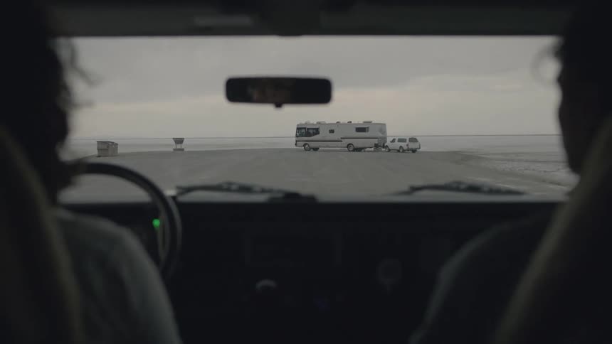 A couple riding inside of a car