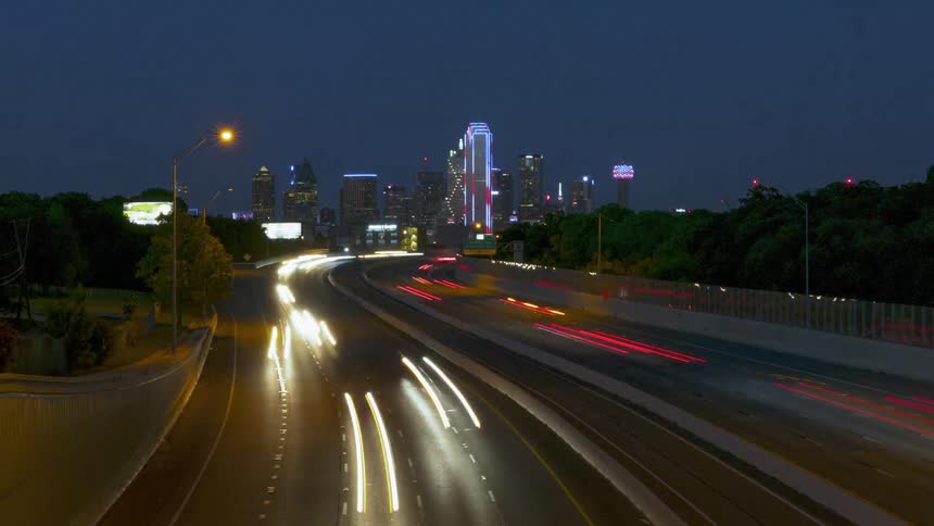 Timelapse of vehicles driving on a highway at night