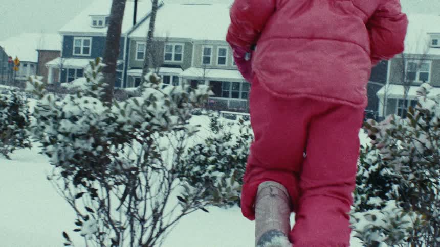 Little girl running in the snow