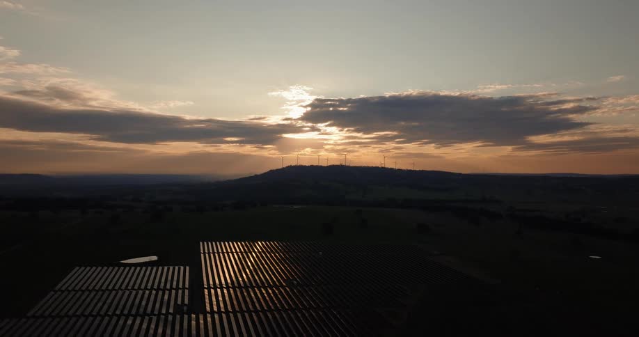 The rising sun shines on the solar panels