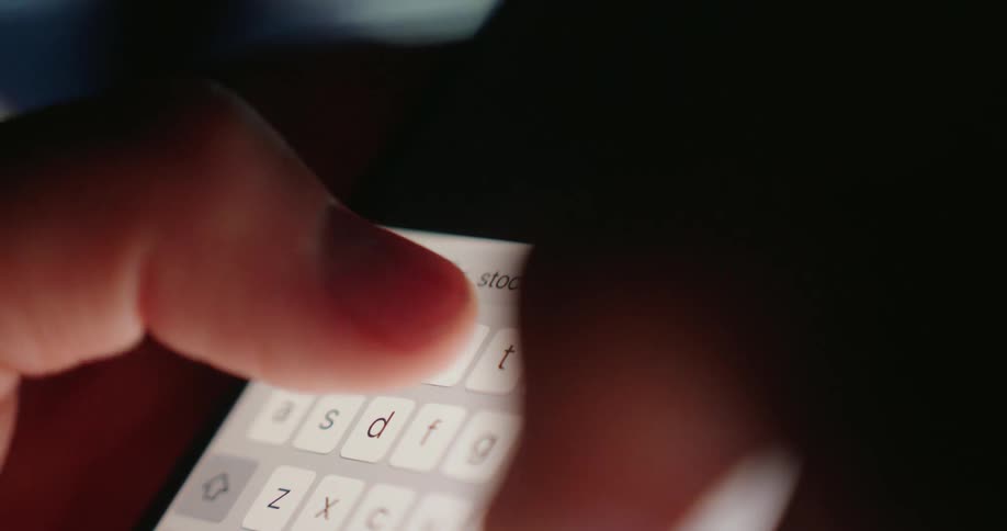 A person typing stock market on a smartphone