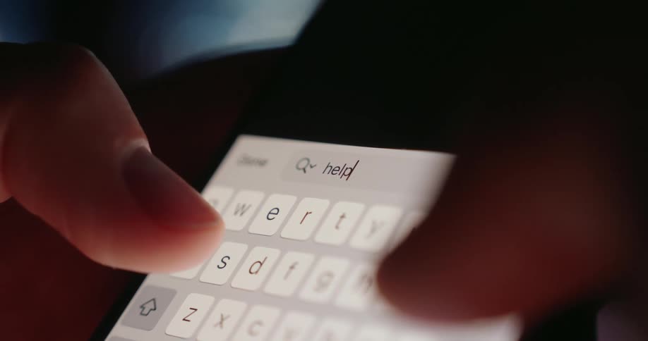 Fingers typing on a smartphone