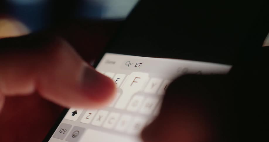 A person typing a text on their phone