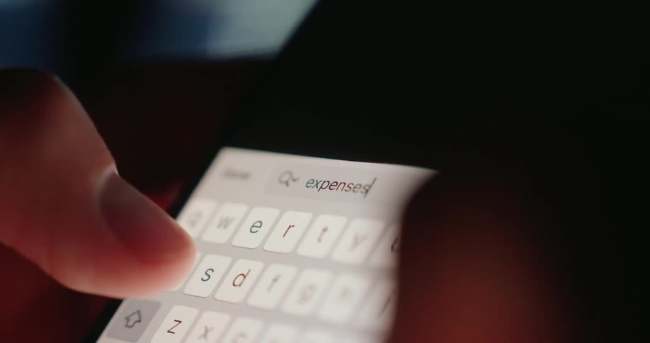 A person types the word expenses into the search engine on their phone