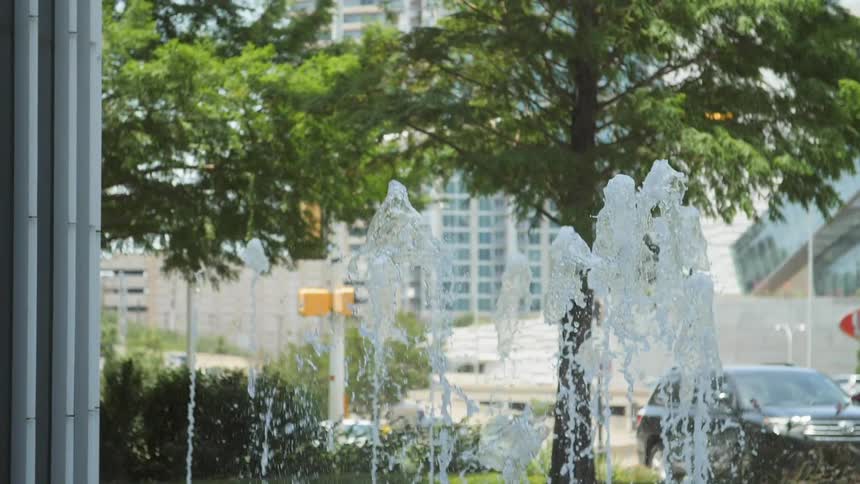 A circular fountain during the day