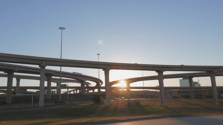 Vehicles drive on a busy highway system