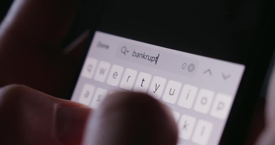 A persons fingers typing on a cell phone screen with white keys