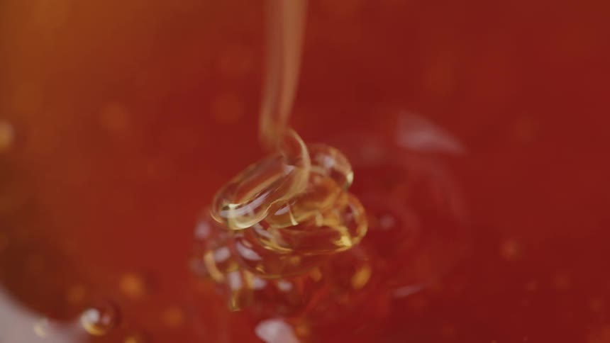 Close up of dripping honey