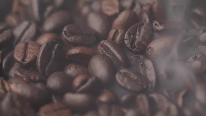 Close up of coffee beans with smoke