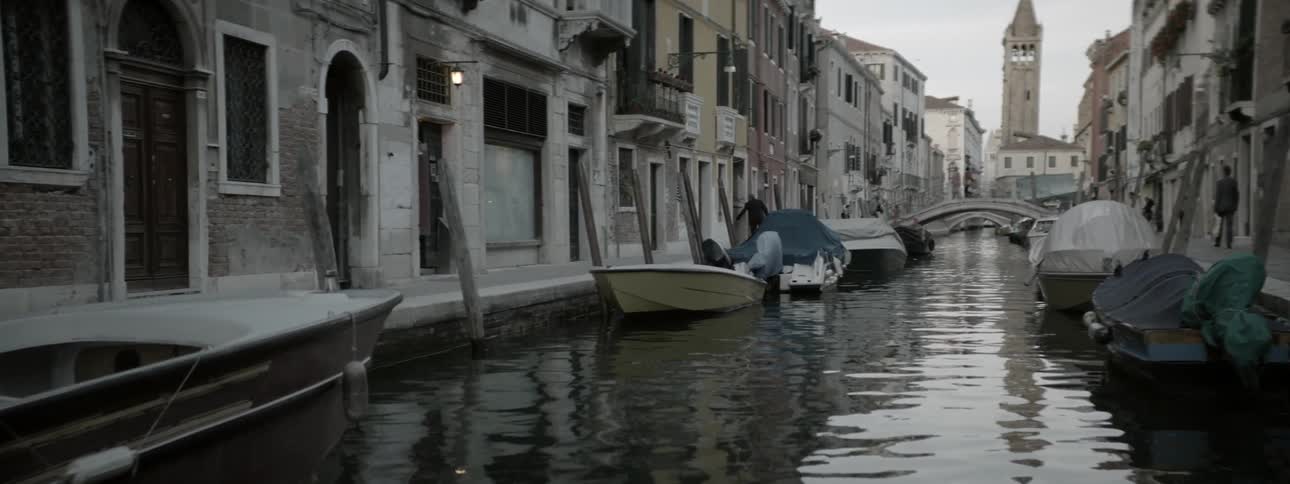 Boats line a city canal