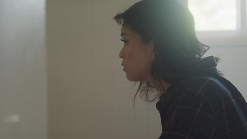 The woman slowly looks up