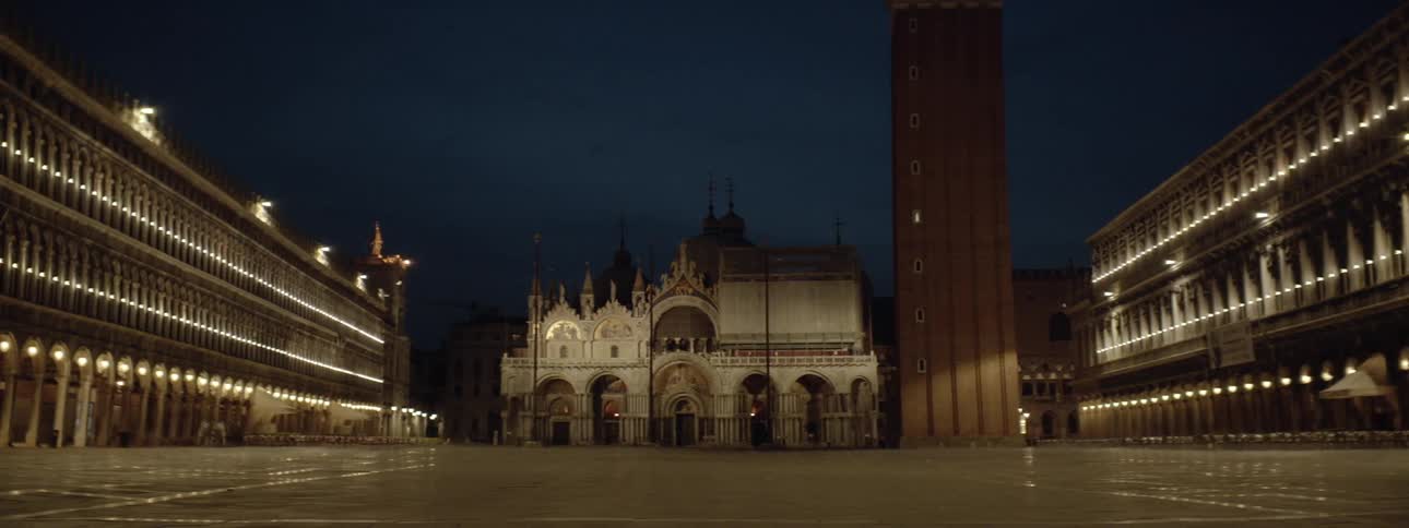 City buildings are shown at night
