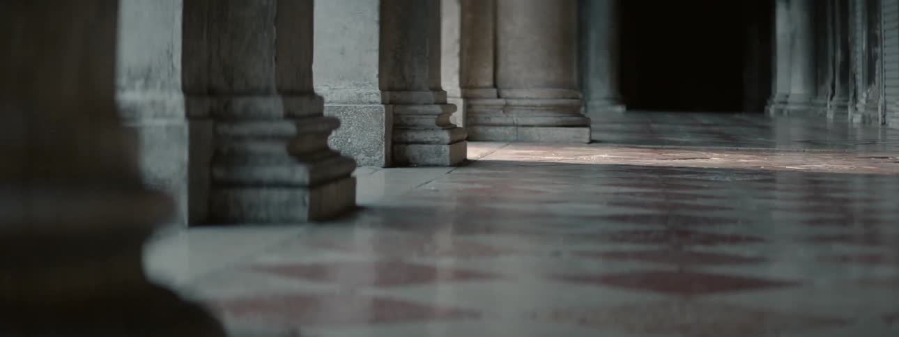 The bottom or ground of a building with pillars