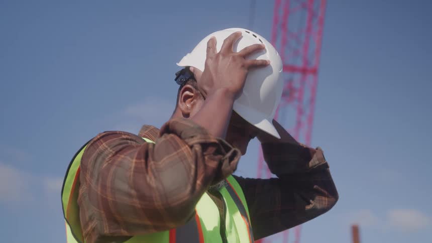 A man putting on a safety helmet