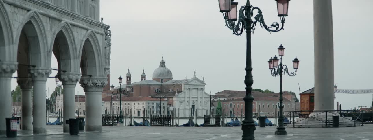 The city ahead has domes at the top and lamps all around