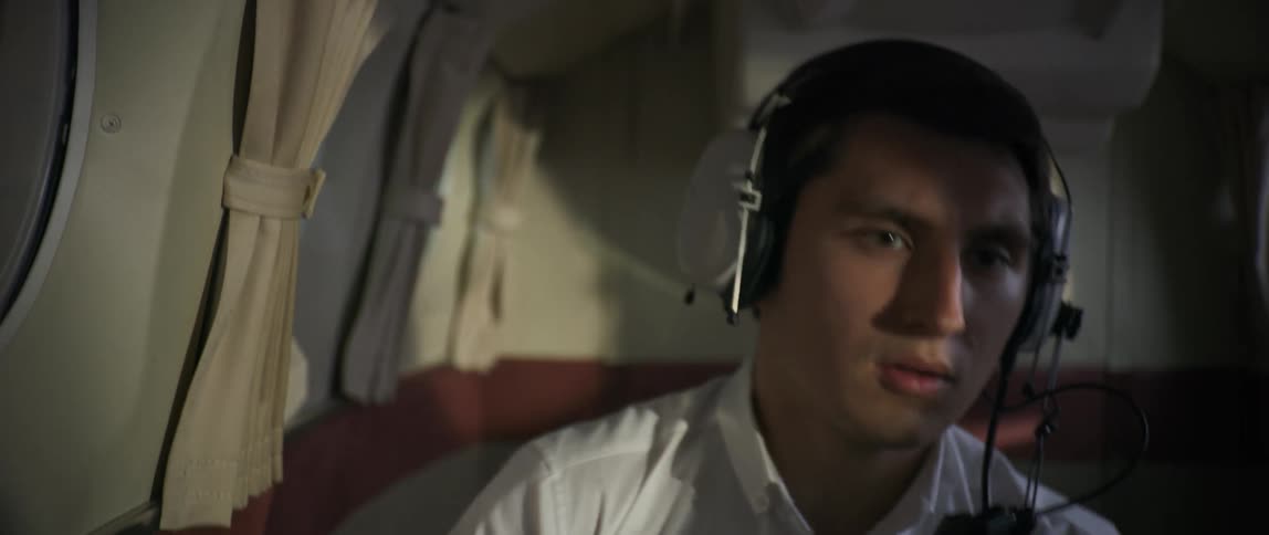 The pilot looks nervous during turbulence on the plane