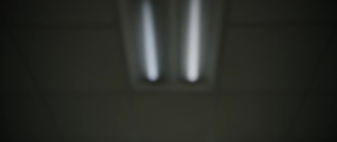 Light bulb lit on the roof of a building