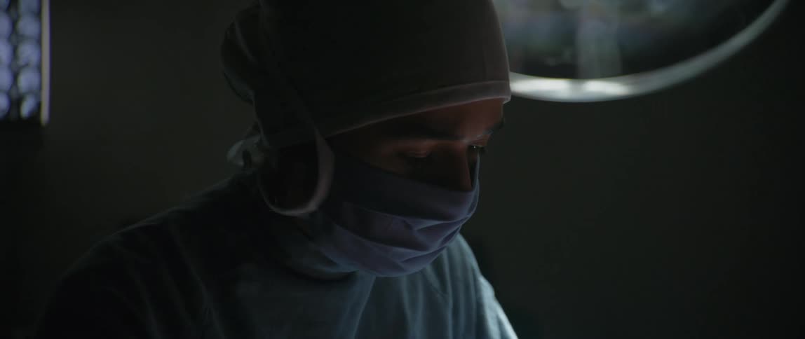 A doctor is working in the operating room