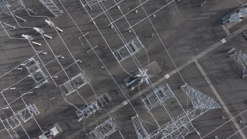 The electrical station is full of towers and wires