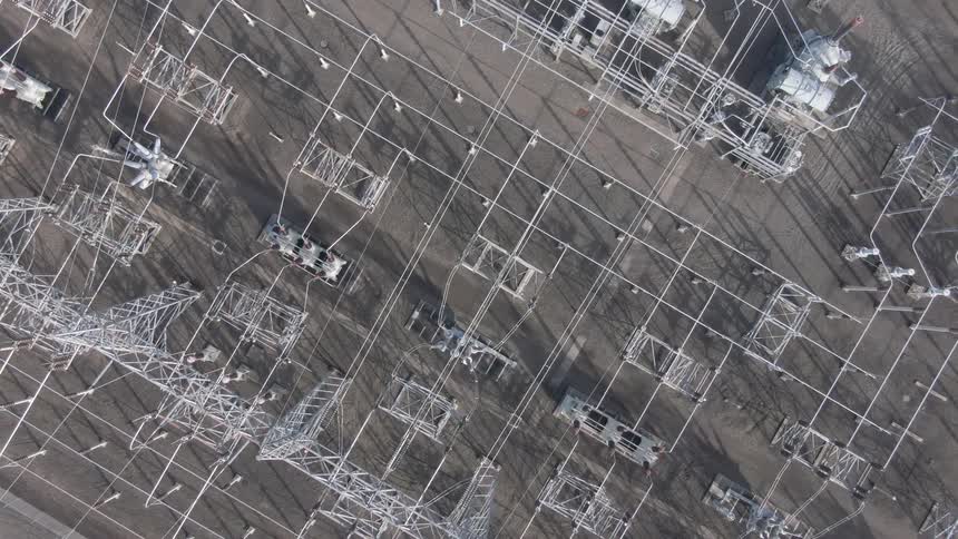 Aerial view of a power substation with gridlike metal structures