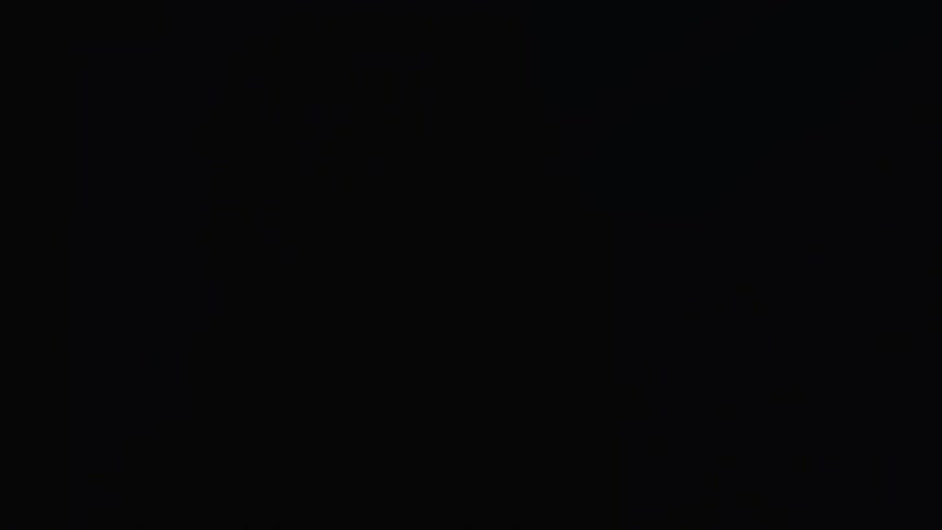 Blue light illuminates the darkness and a male profile
