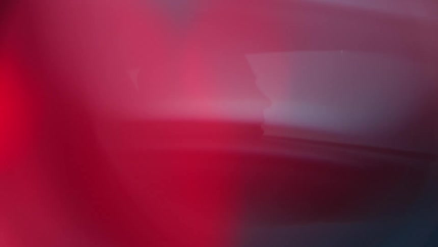 Silhouette of a person driving a car