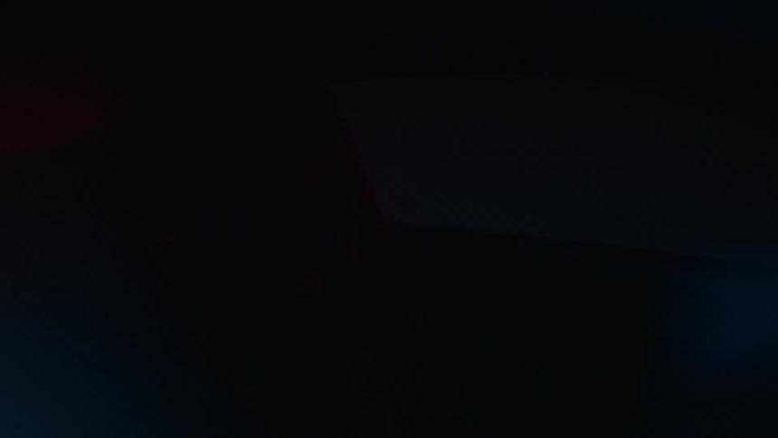The man is sitting in the parked car