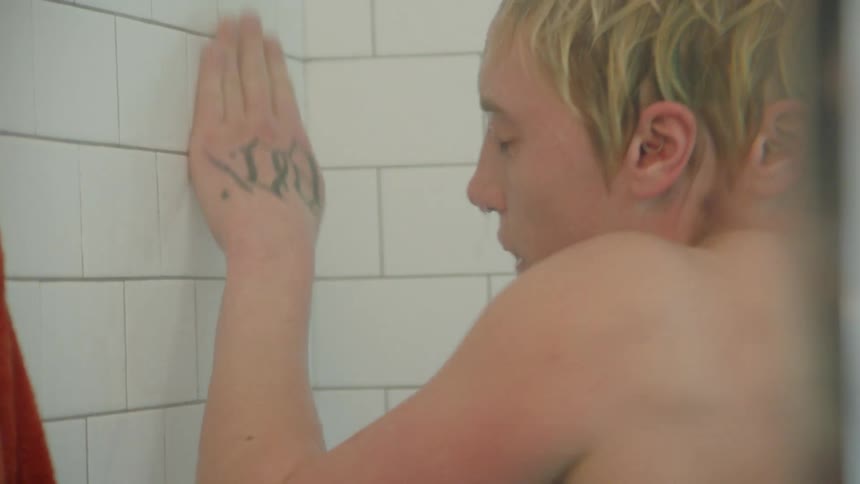A woman is dancing in the shower