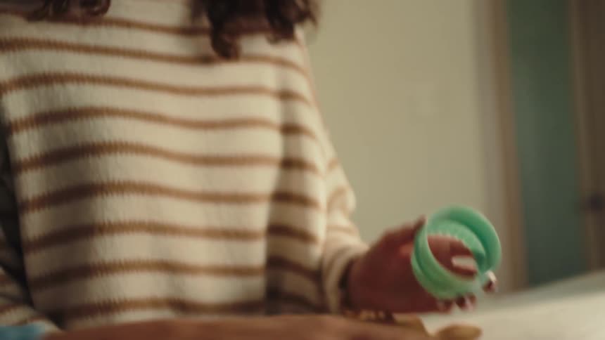 A girl making cookies in the kitchen
