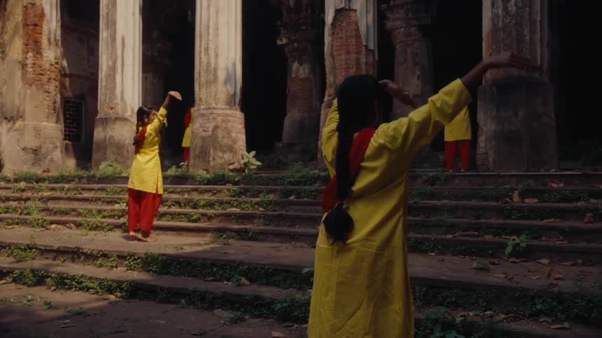 A group of women is doing a dance ritual at a temple