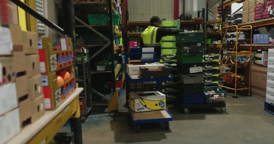 Workers are moving boxes in the warehouse