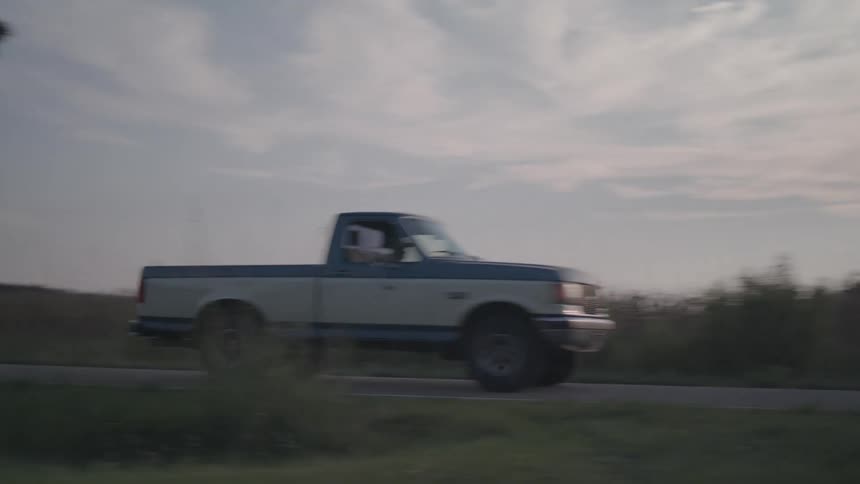 The truck passes by on the road
