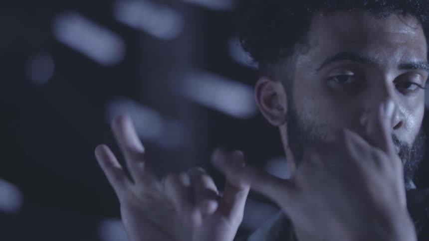 Portrait of a man dancing and moving his fingers