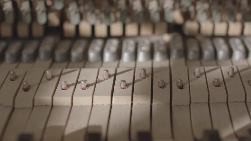 Internal parts of a piano move while the musical instrument is played