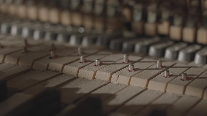 Piano internals move as the piano keys are pressed