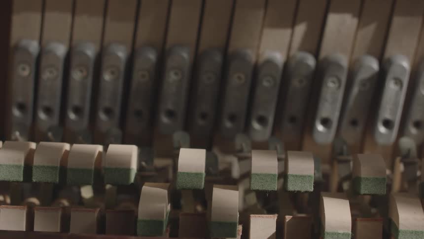 Internal piano components move as the instrument is played