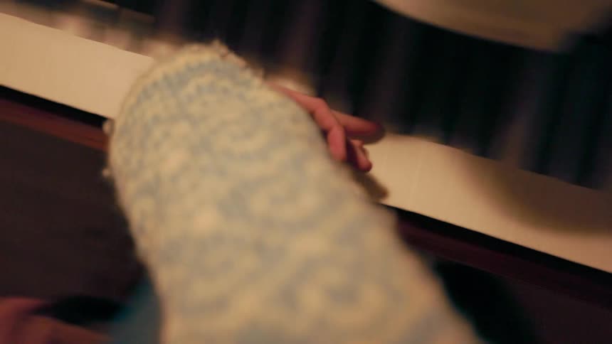 Female hand being passed over all the keys of a piano