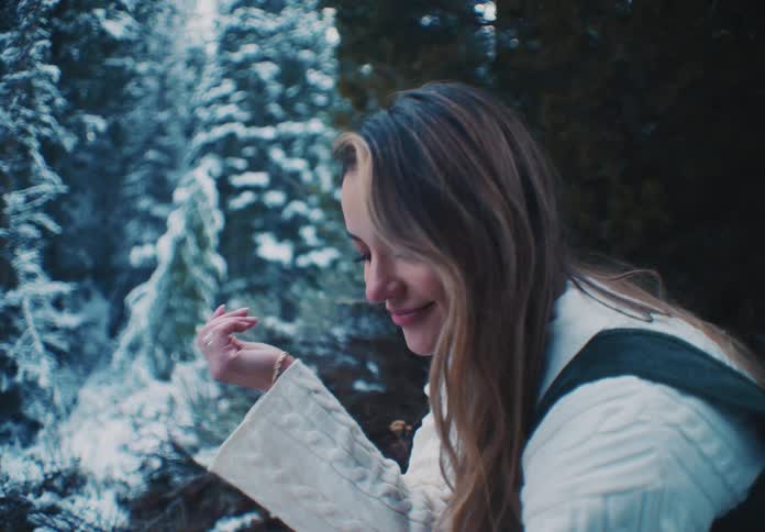 Woman blowing ice on her hands