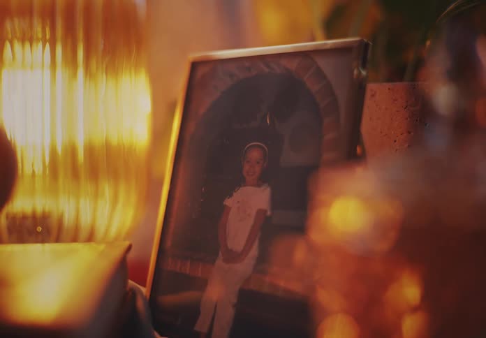 A picture of a young girl sits on a table