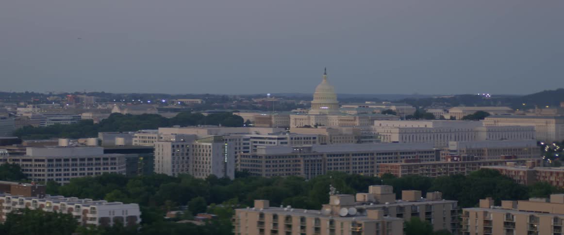 City buildings are shown in the distance