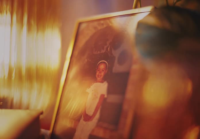A picture of a girl is in a frame