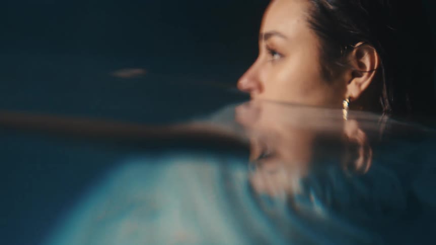 A woman is walking in the pool