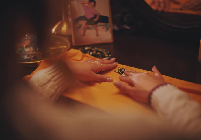 A woman is placing cat embroideries on the fabric